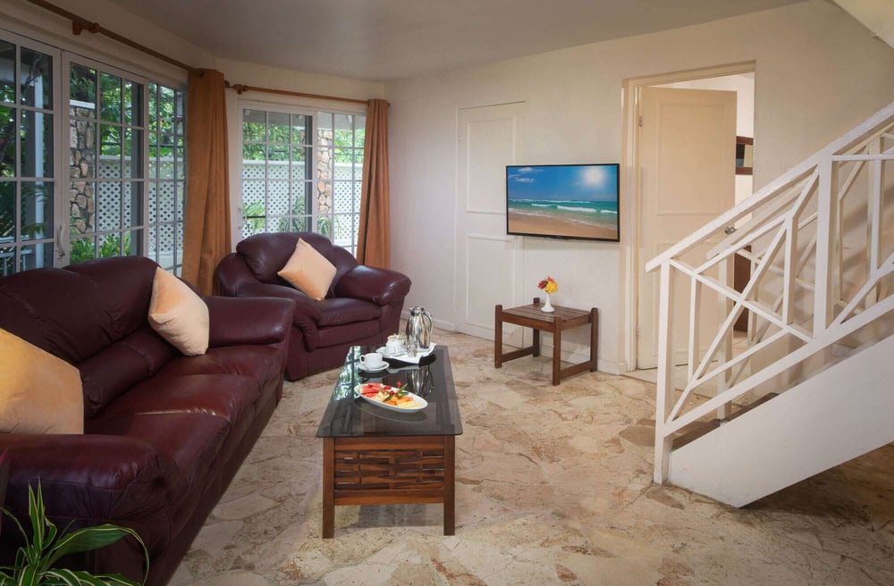 Beachfront room in Negril with king or double beds, kitchen, 3 bathrooms, verandah, and whirlpool.