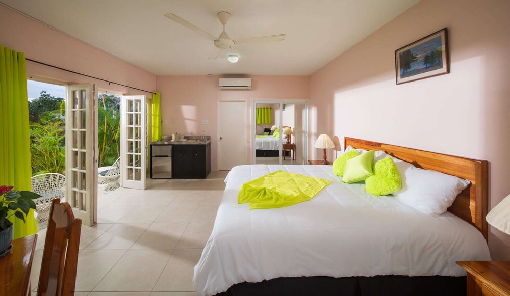 Beachfront room in Negril with king bed, rain shower, minibar, in-room safe, private patio, and separate entrance.